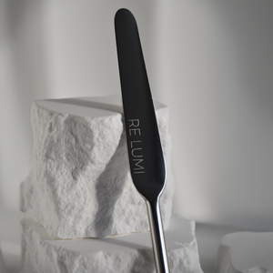 Silver stainless spatula zoomed in  with whine stone background