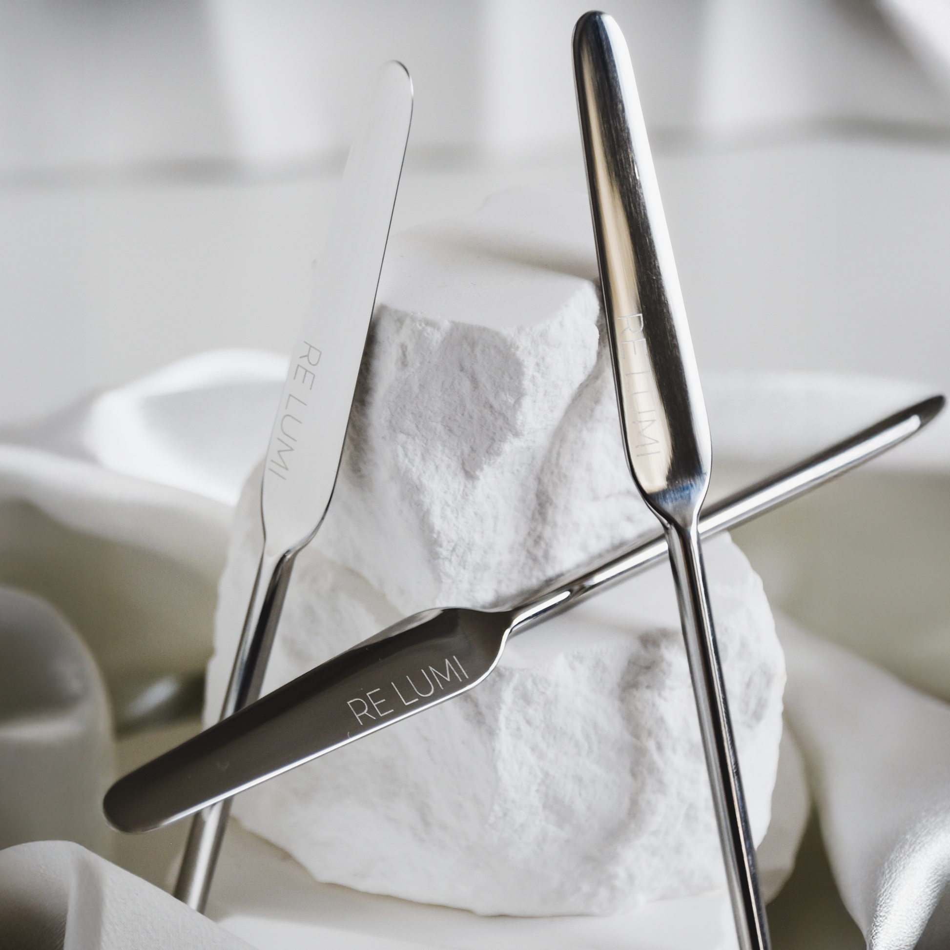 Stainless Spatulas with 'RE LUMI' branding on a white background