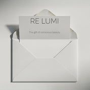 RE LUMI gift card in a white envelope, minimalist design with card message “The gift of conscious beauty” for digital gifting.