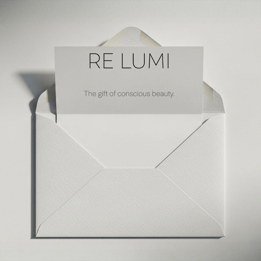 RE LUMI gift card in a white envelope, minimalist design with card message “The gift of conscious beauty” for digital gifting.