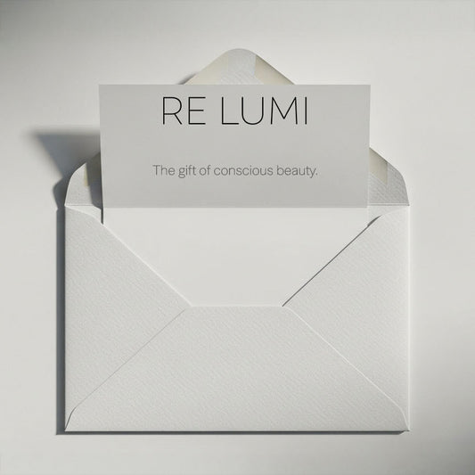 RE LUMI gift card in a white envelope, minimalist design with card message “The gift of conscious beauty” for digital gifting.