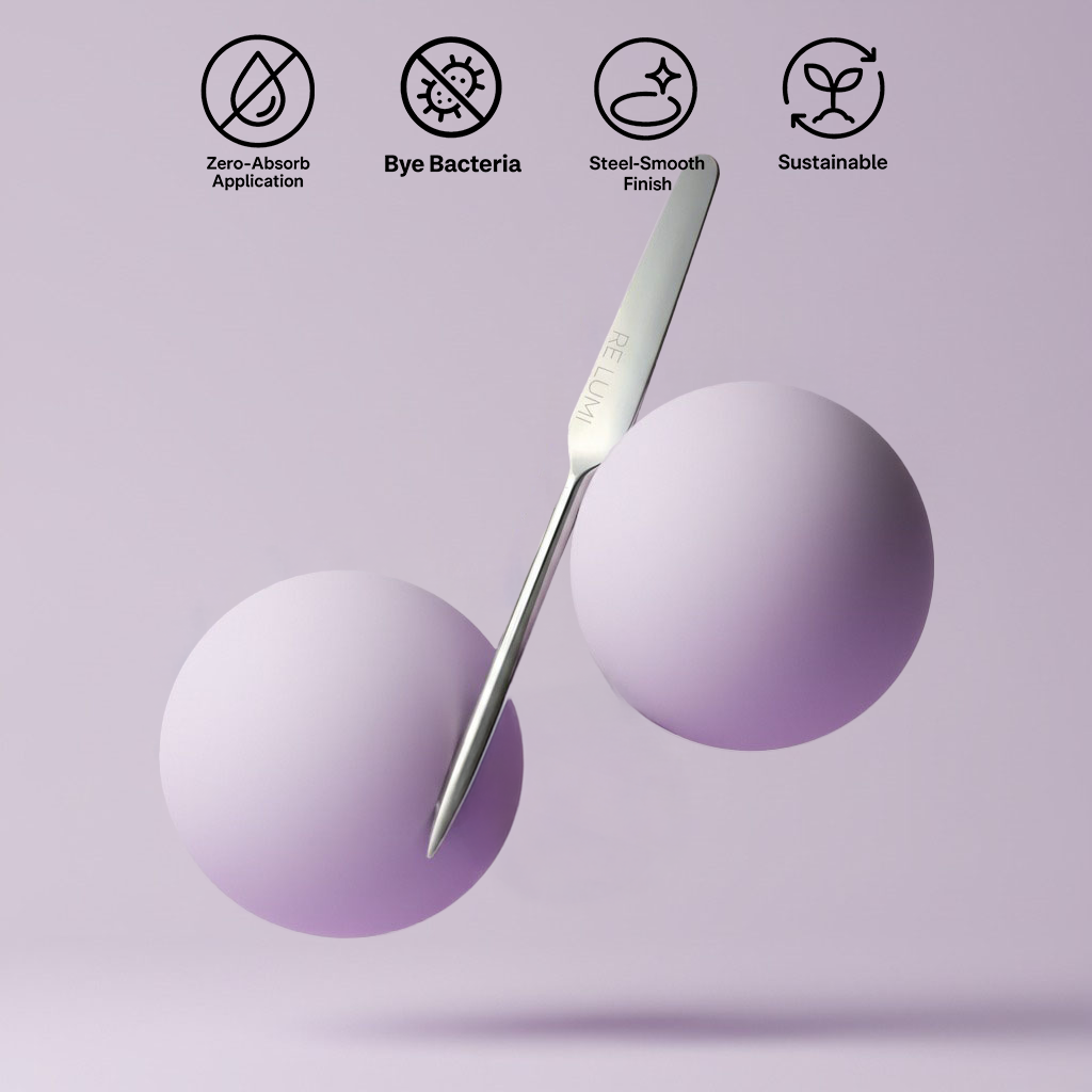 RE LUMI stainless steel spatula between lavender spheres with icons for zero-absorb, bye bacteria, sustainable, steel-smooth K-beauty design.