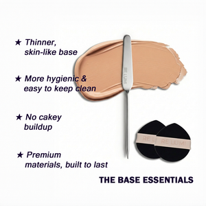 RE LUMI stainless steel foundation spatula with two black makeup puffs showing thin, skin-like base application and hygienic tools